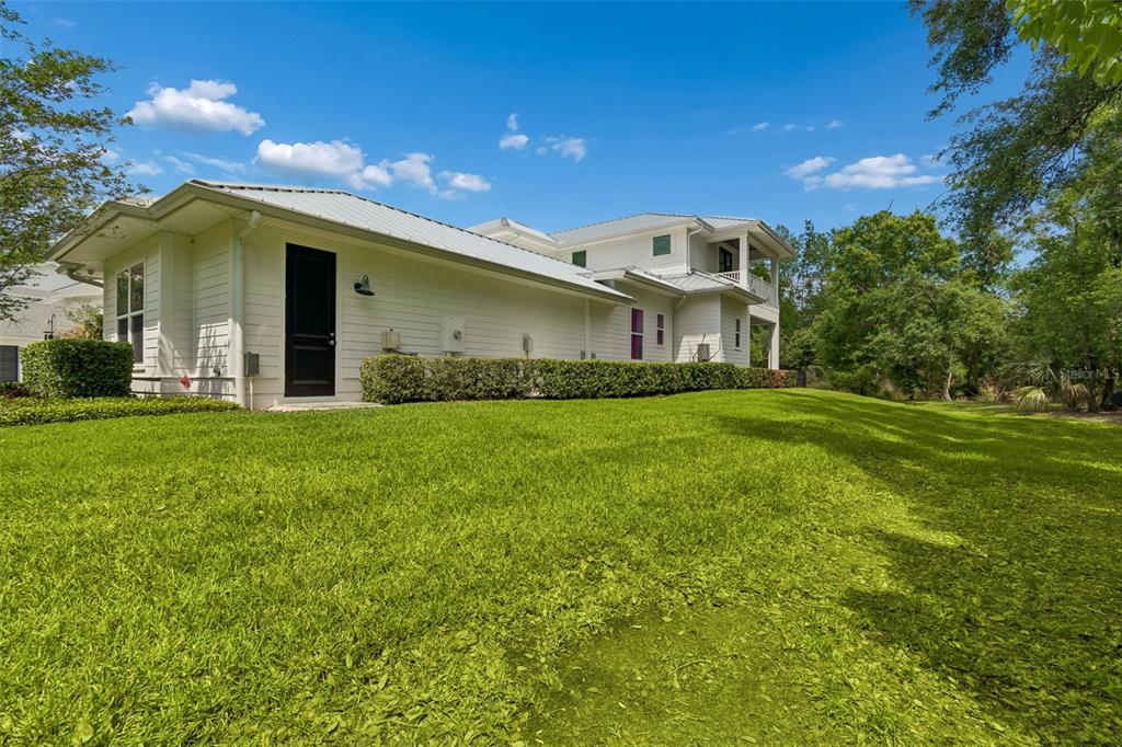17001 Midas Lane Lutz, FL 33549 - Photo 86 of 100 a front view of a house with a yard