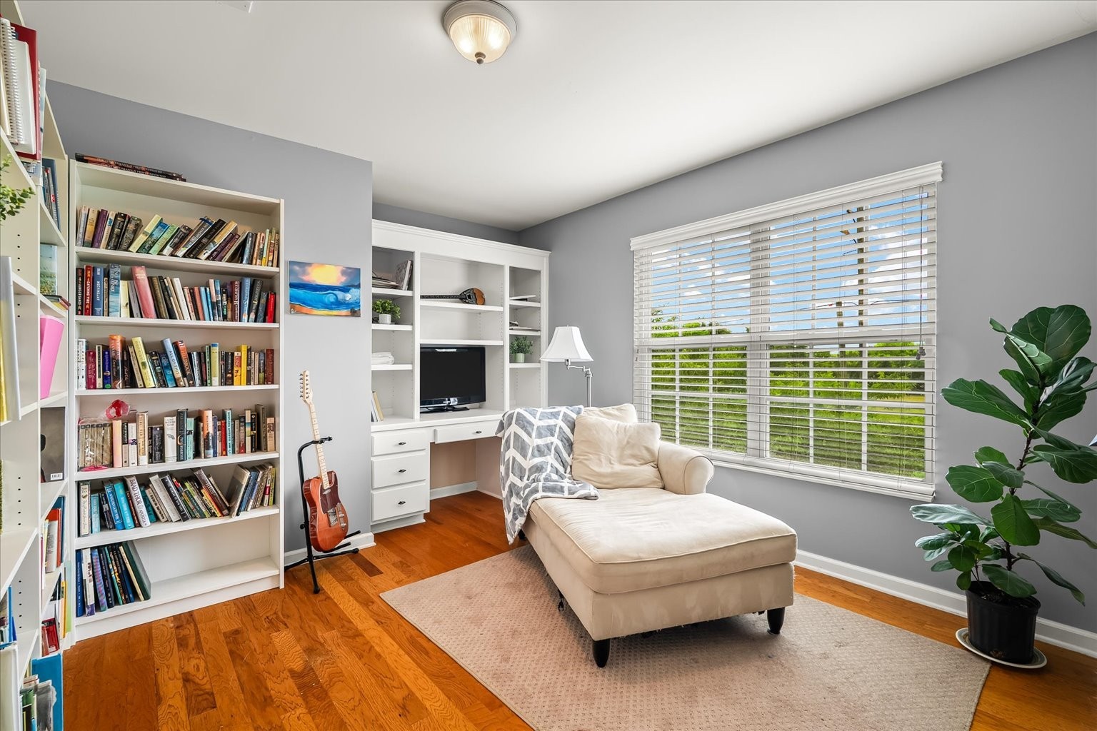 4055 Williford Way Spring Hill, TN 37174 - Photo 14 of 37 a living room with furniture and a book shelf