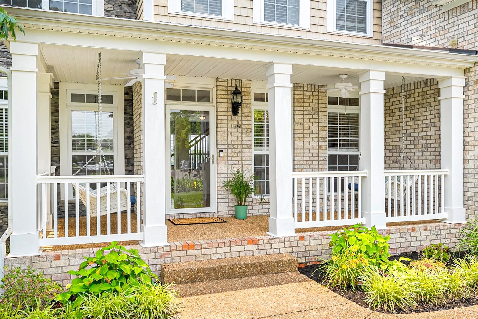 4055 Williford Way Spring Hill, TN 37174 - Photo 2 of 37 a view of a brick house with a large window and wooden fence