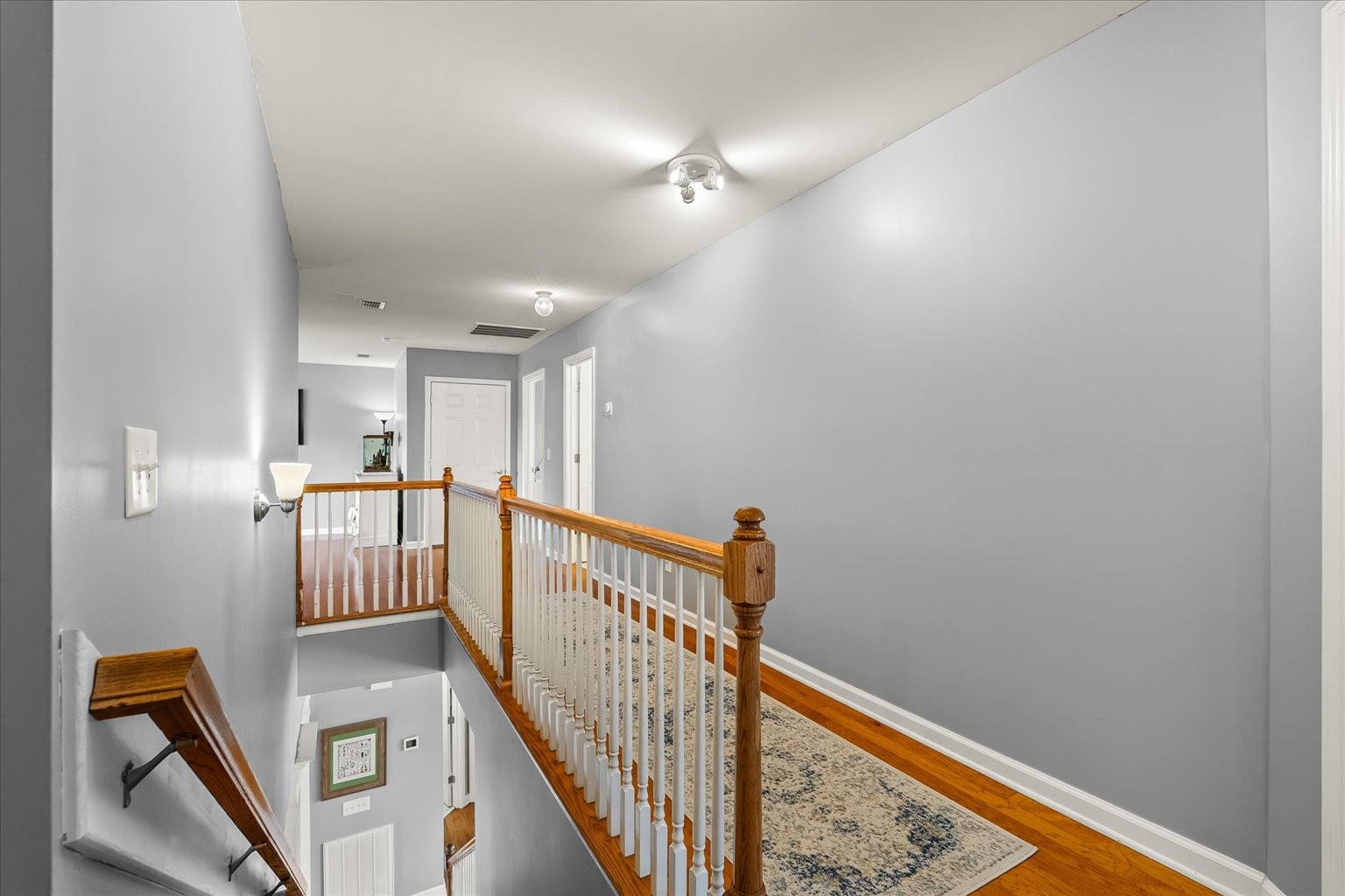 4055 Williford Way Spring Hill, TN 37174 - Photo 24 of 37 a view of a hallway with wooden floor and staircase