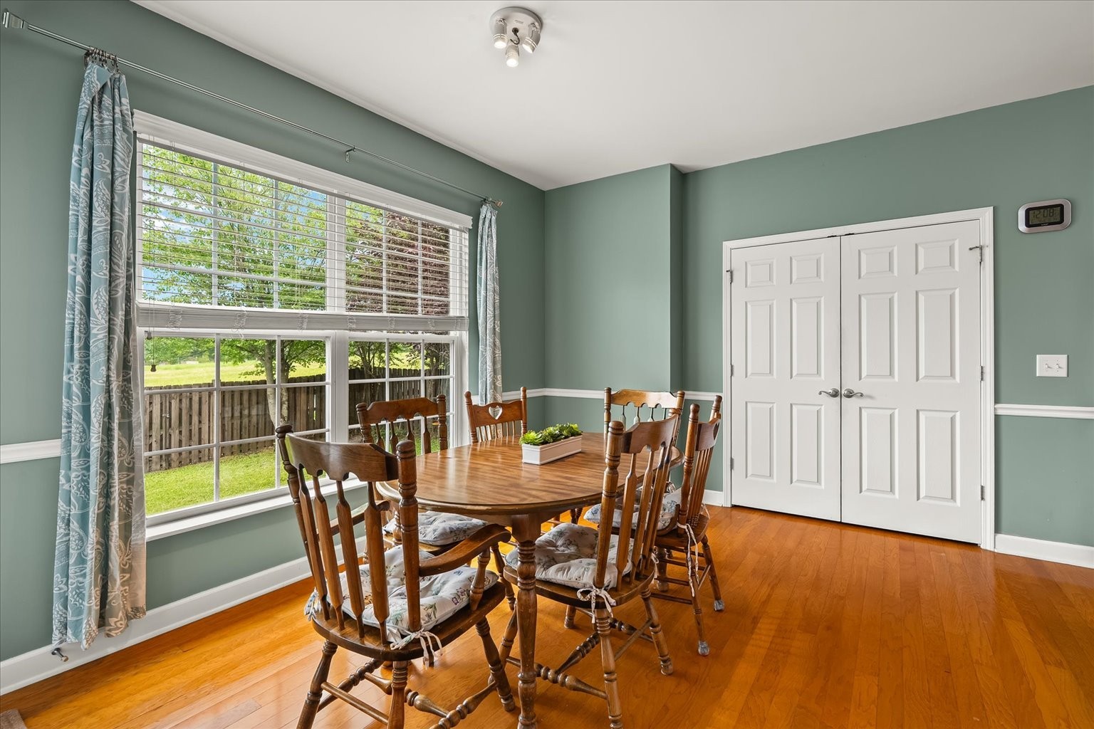 4055 Williford Way Spring Hill, TN 37174 - Photo 10 of 37 a view of a dining room with furniture and wooden floor