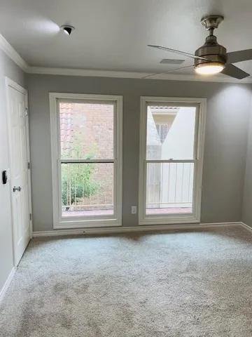 an empty room with a empty space and windows