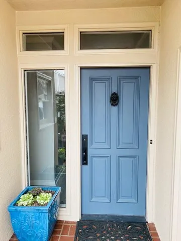 a front view of a house with pots