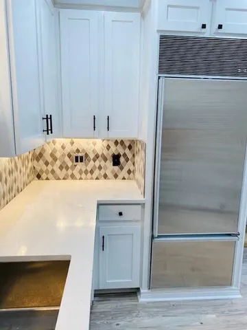 a bathroom with a bathtub and shower