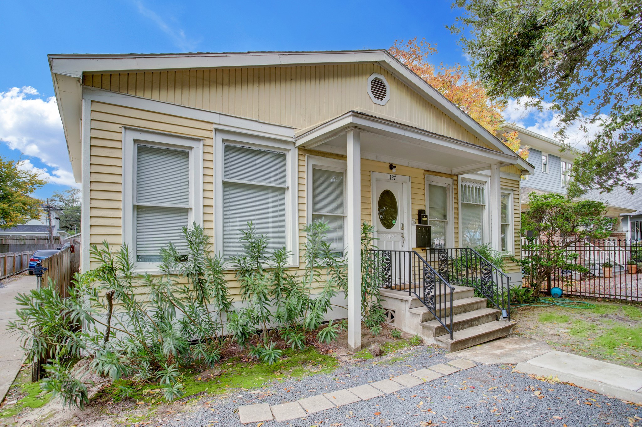 1127 Yale Street, Unit B Houston, TX 77008 - Photo 1 of 14 a front view of a house with a garden