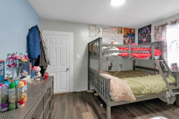 a bedroom with furniture and a baby crib
