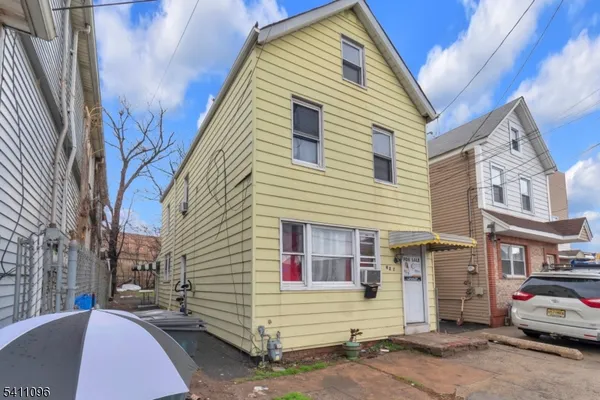 a view of a house with a street