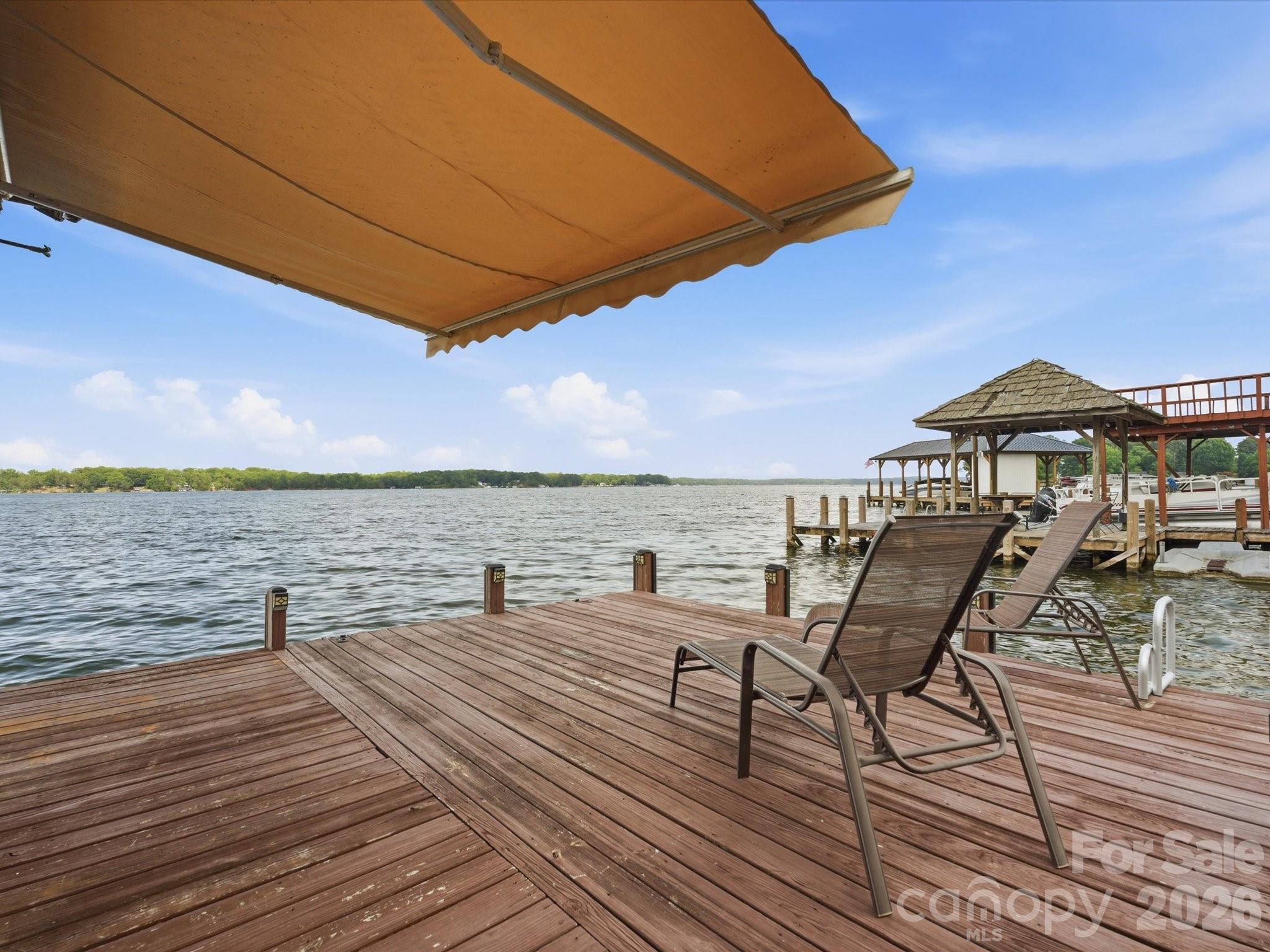 562 Lake Head Road Norwood, NC 28128 - Photo 5 of 43 a view of a terrace with wooden floor and outdoor seating