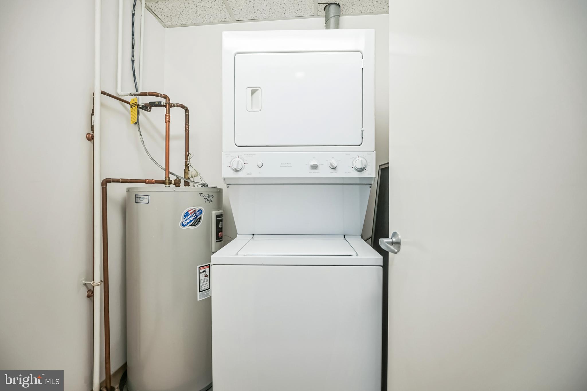 1101 Locust Street, Unit 4E Philadelphia, PA 19107 - Photo 12 of 15 a utility room with dryer and washer