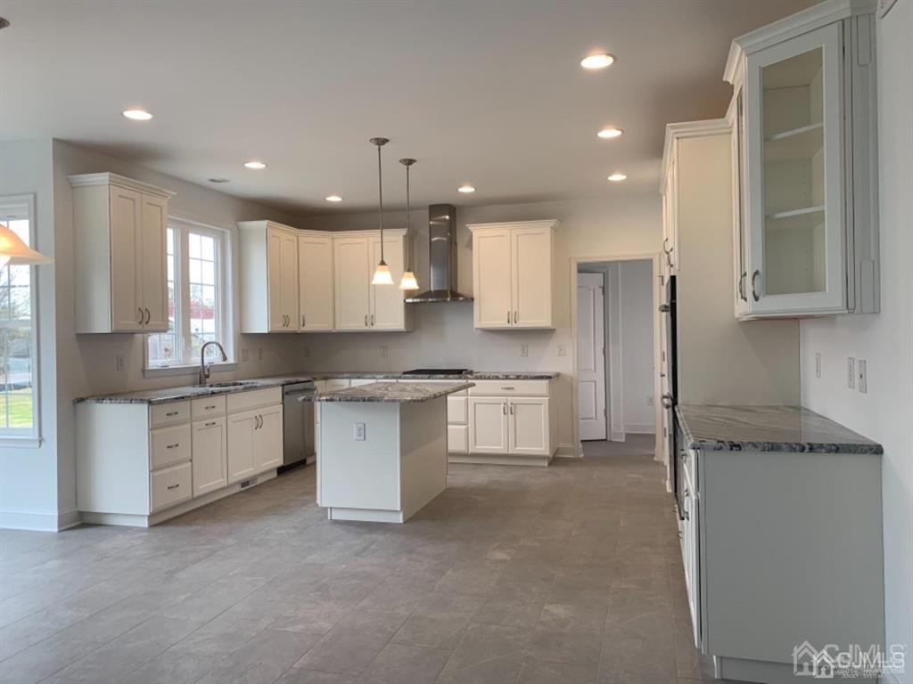 21 May Road East Brunswick, NJ 08816 - Photo 11 of 18 a large kitchen with cabinets stove top oven and sink