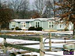 2297 Monmouth Road Jobstown, NJ 08041 - Photo 1 of 1 a front view of a house with a garden