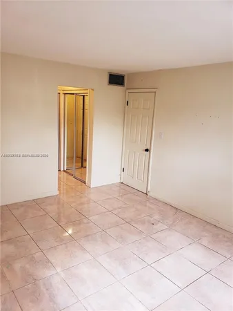 a view of a room with an empty space