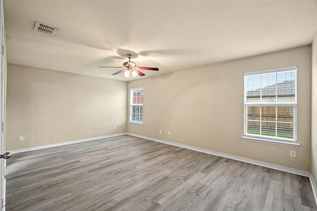 4024 Mantis Street Fort Worth, TX 76106 - Photo 15 of 27 wooden floor in an empty room with a window
