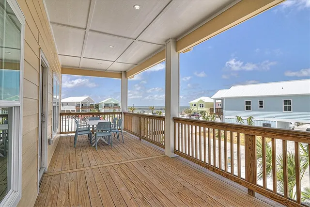 a balcony with wooden floor