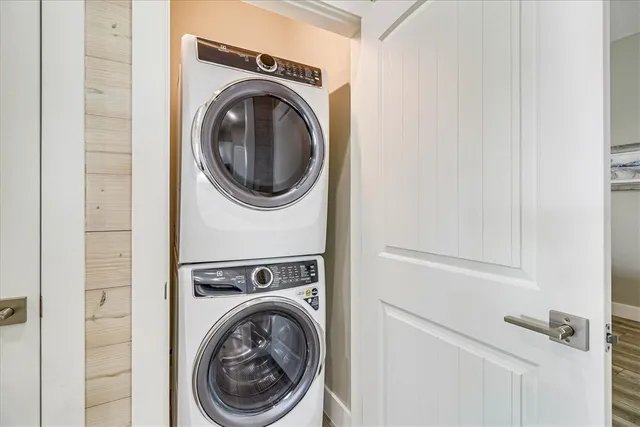 a view of a hallway with washer and dryer