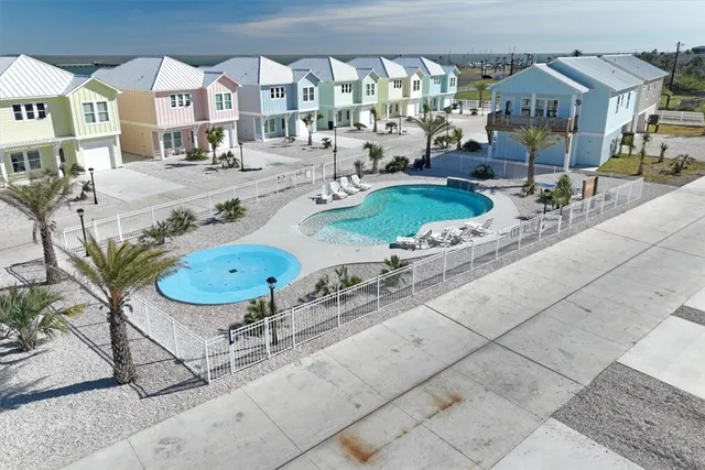 a view of swimming pool with outdoor seating