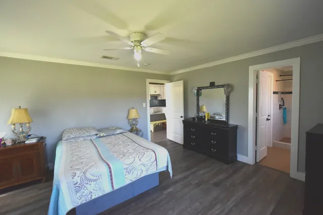 a bedroom with a bed and a dresser