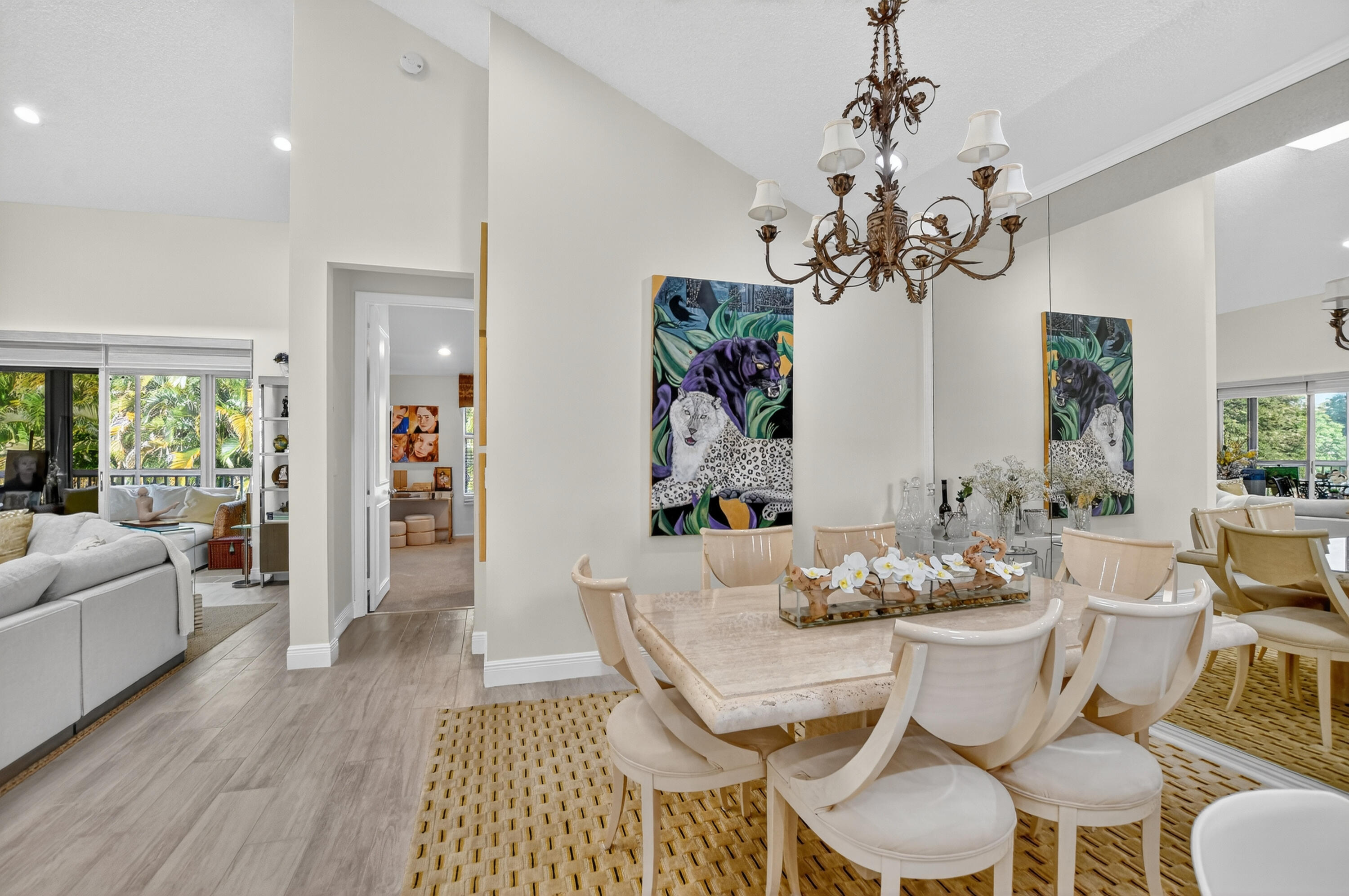 20220 Boca W Drive, Unit 202 Boca Raton, FL 33434 - Photo 11 of 129 a view of a dining room with furniture wooden floor and chandelier