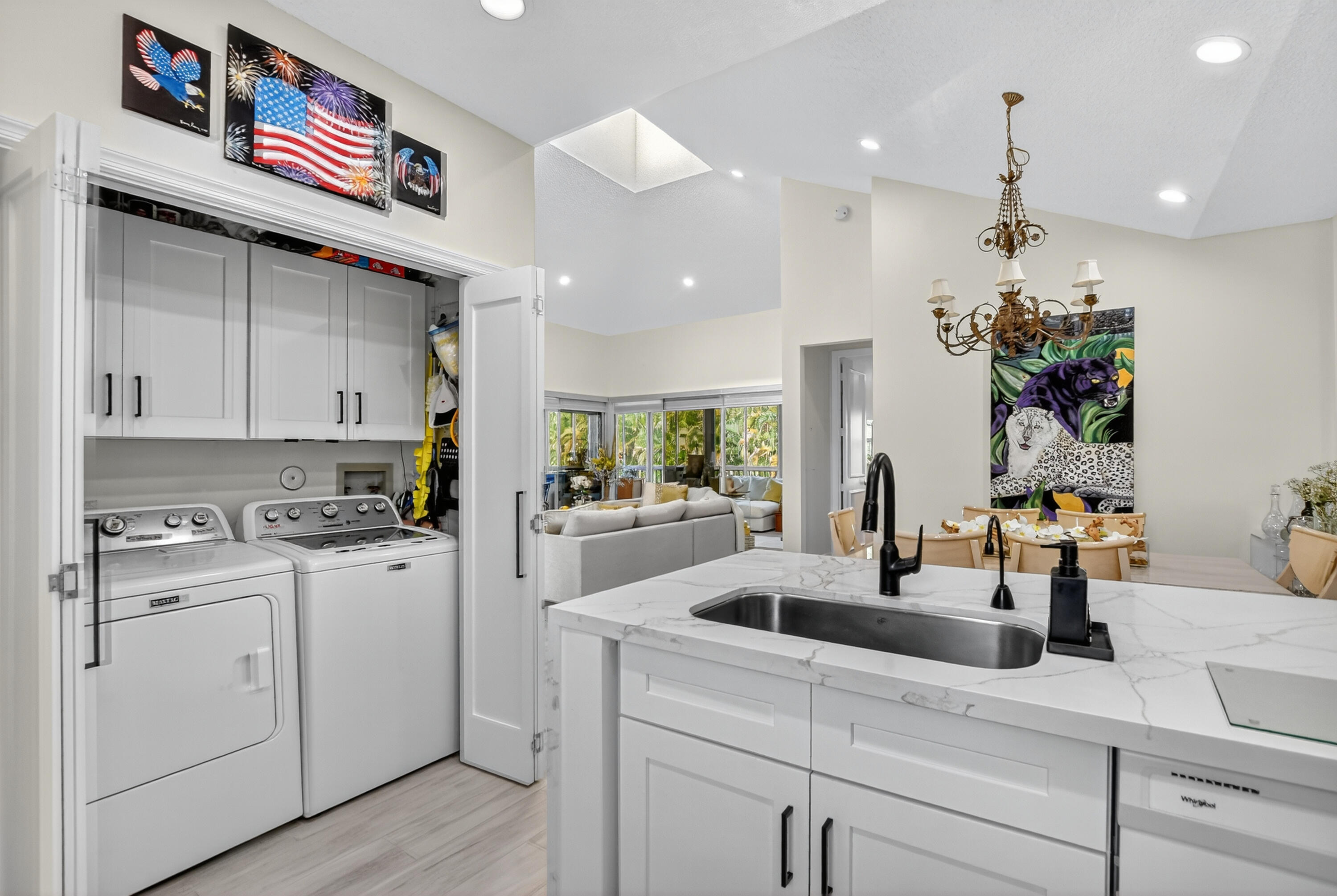 20220 Boca W Drive, Unit 202 Boca Raton, FL 33434 - Photo 15 of 129 a kitchen with kitchen island granite countertop a sink cabinets and window