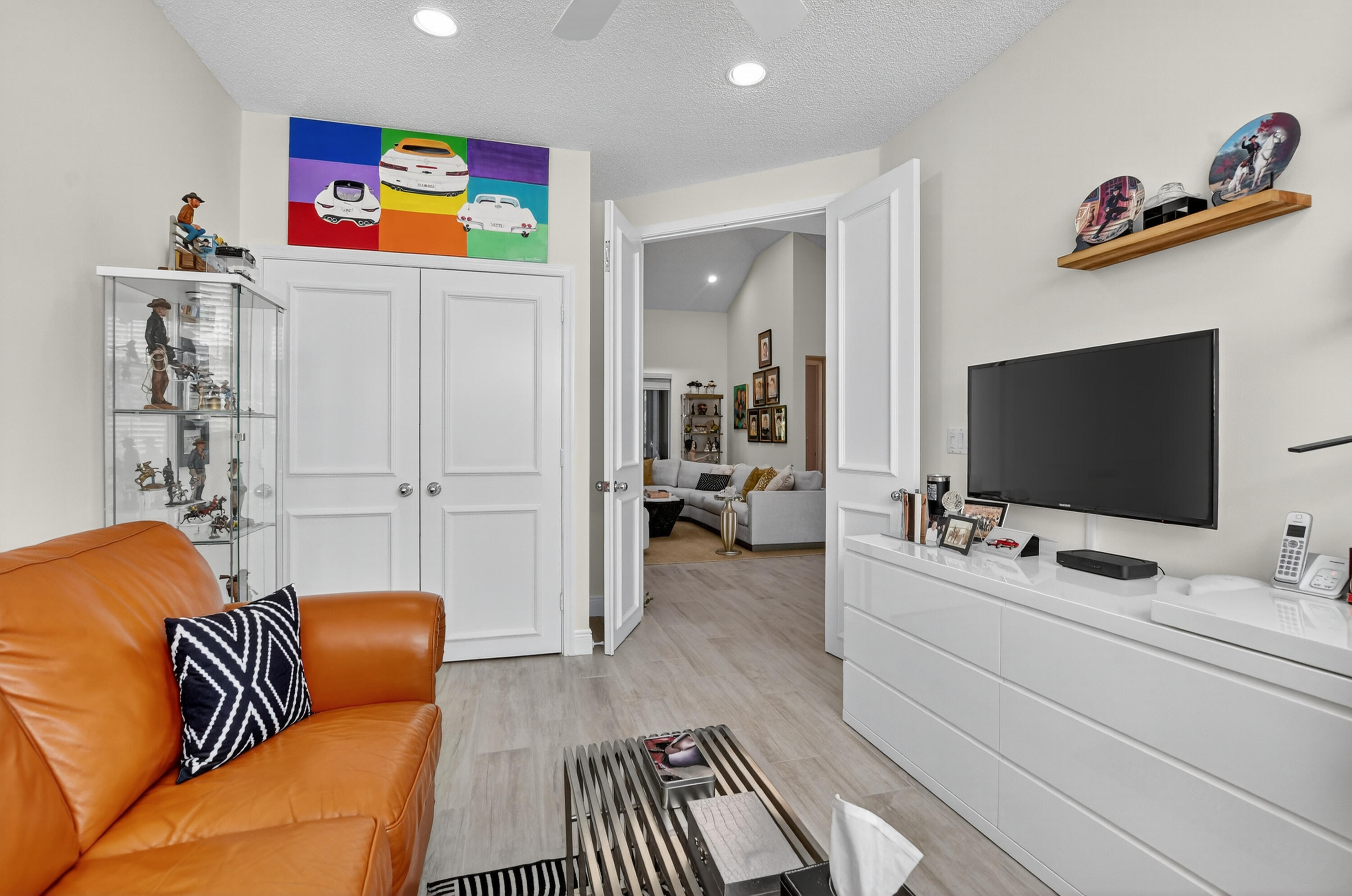 20220 Boca W Drive, Unit 202 Boca Raton, FL 33434 - Photo 17 of 129 a bedroom with furniture and a flat screen tv