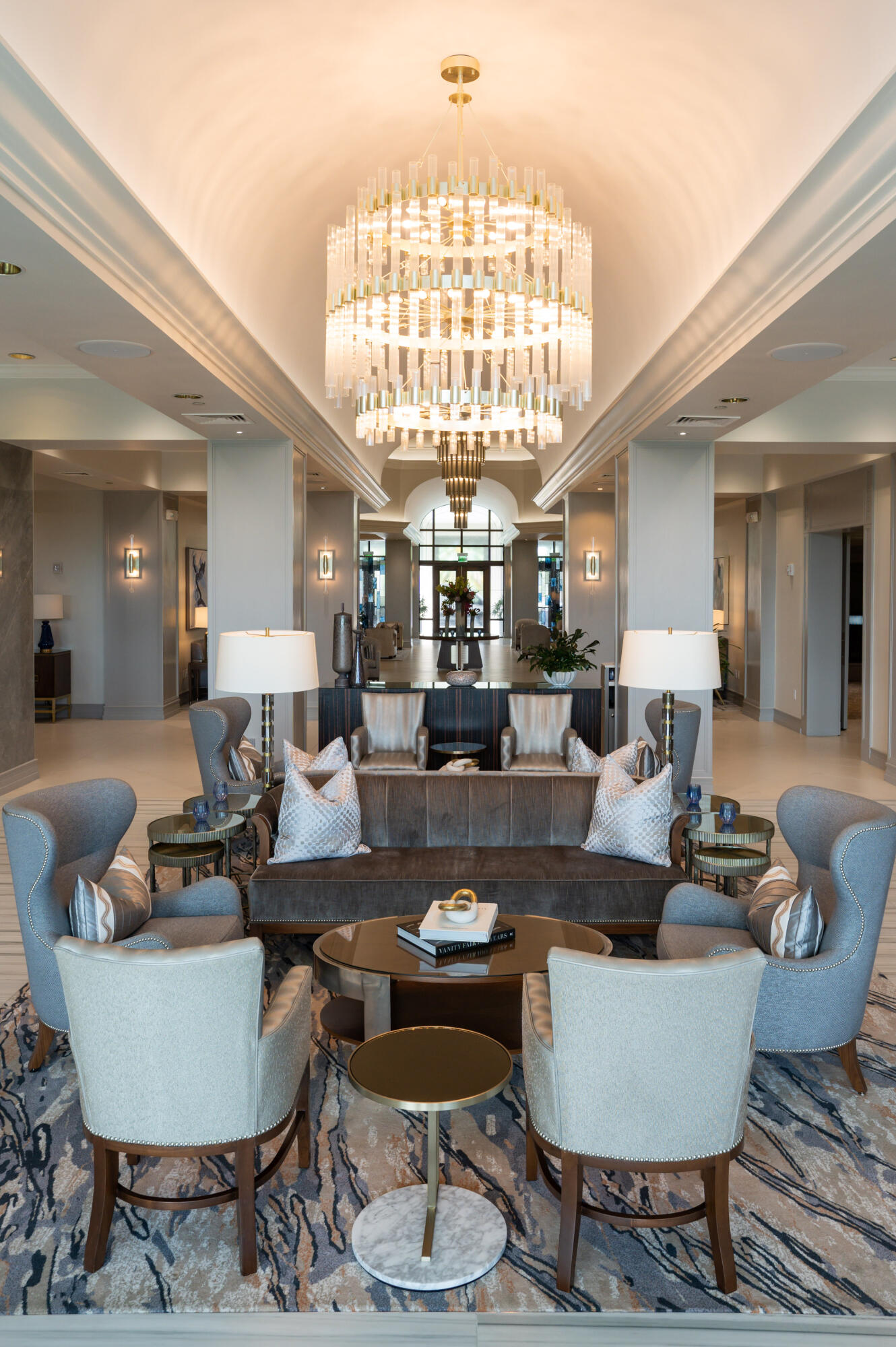 20220 Boca W Drive, Unit 202 Boca Raton, FL 33434 - Photo 52 of 129 a living room with furniture a chandelier and a large window