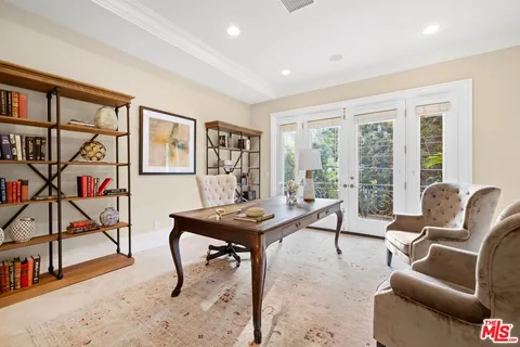 a living room with furniture and a flat screen tv with wooden floor