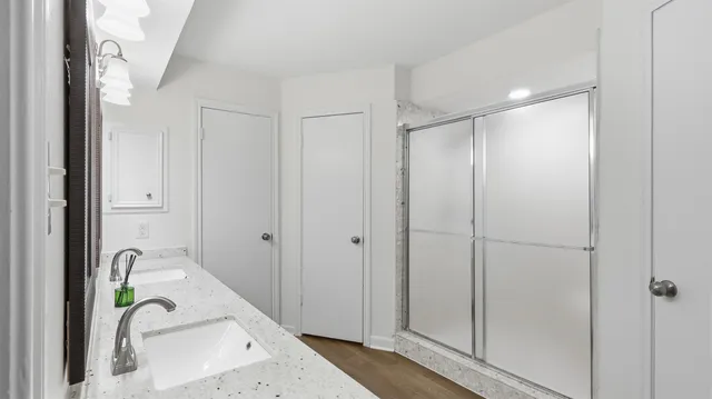 a bathroom with a bathtub and shower