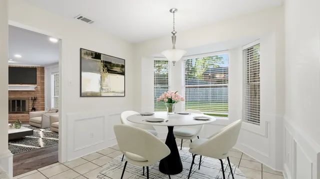 a view of a dining room with furniture window and outside view