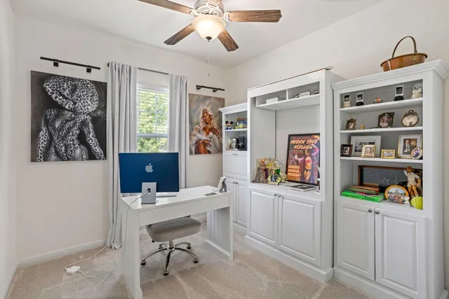 a view of a bathroom with sink mirror and window