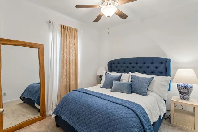 a en suite bathroom with a double vanity sink and a mirror