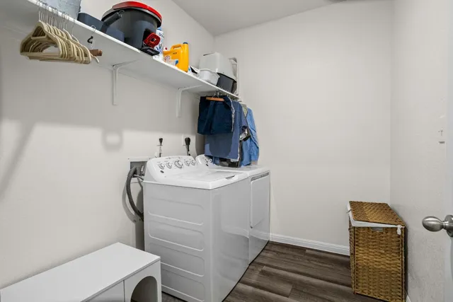 a bathroom with a sink a toilet a mirror and shower curtain