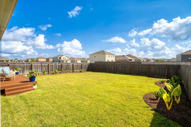 a view of walk in closet with clothes