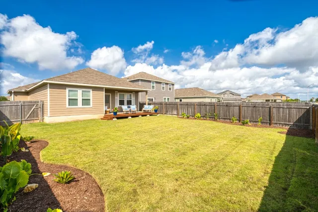a view of a swimming pool with an outdoor seating