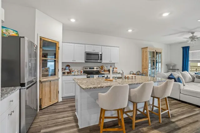 a swimming pool with outdoor seating and yard