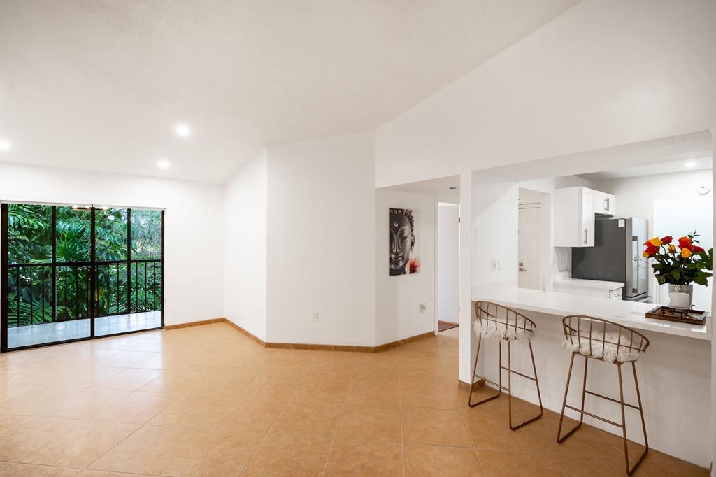 927 Northeast 199th Street, Unit 202 Miami, FL 33179 - Photo 12 of 39 a view of an empty room with a window