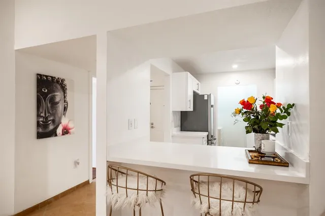 a view of living room with furniture and flowers
