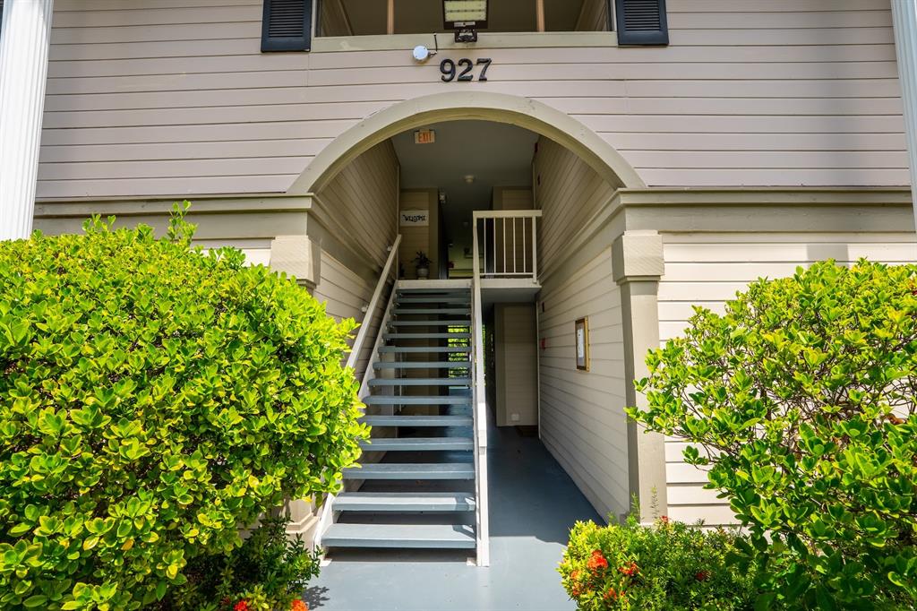 927 Northeast 199th Street, Unit 202 Miami, FL 33179 - Photo 19 of 39 a view of entryway with flower plants