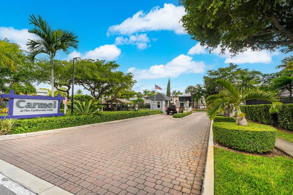 927 Northeast 199th Street, Unit 202 Miami, FL 33179 - Photo 21 of 39 a view of a street both side of house