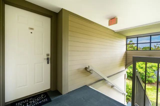 a kitchen with a sink stove and microwave