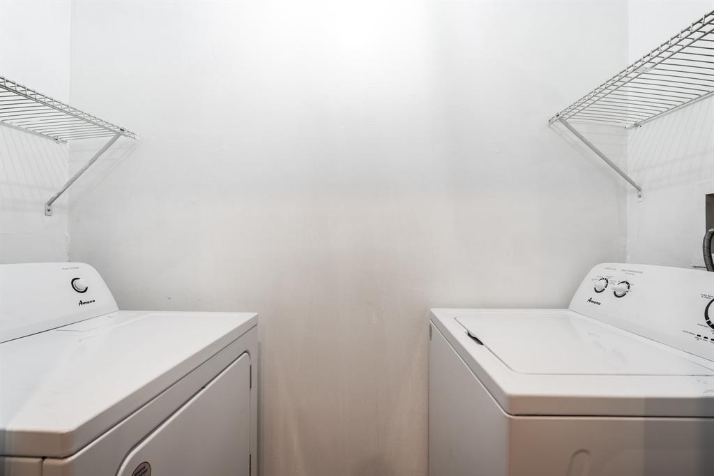 927 Northeast 199th Street, Unit 202 Miami, FL 33179 - Photo 26 of 39 a utility room with dryer and washer