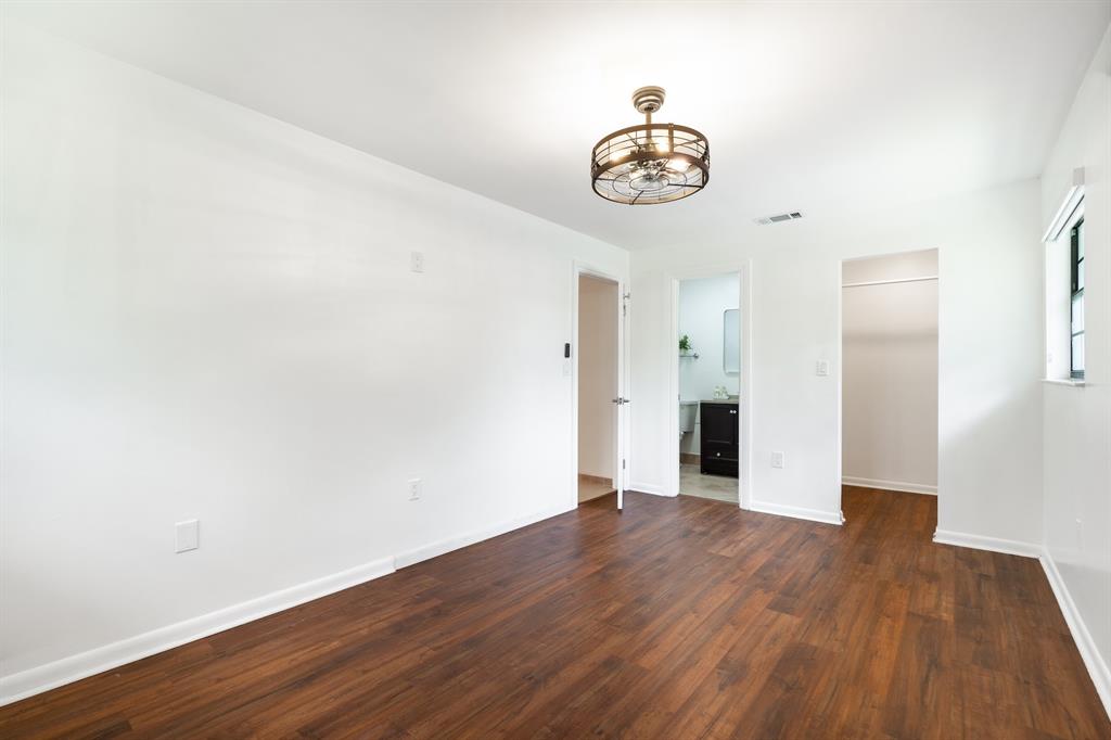 927 Northeast 199th Street, Unit 202 Miami, FL 33179 - Photo 30 of 39 a view of an empty room with wooden floor