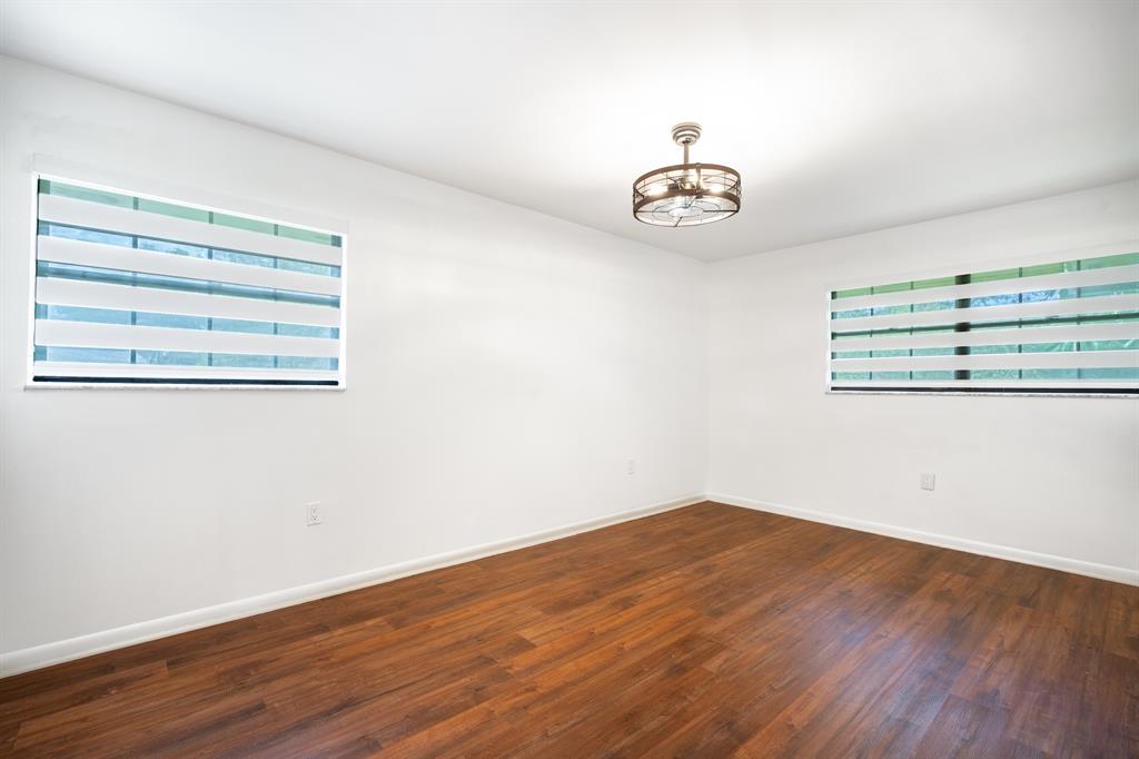 927 Northeast 199th Street, Unit 202 Miami, FL 33179 - Photo 31 of 39 wooden floor in a empty room