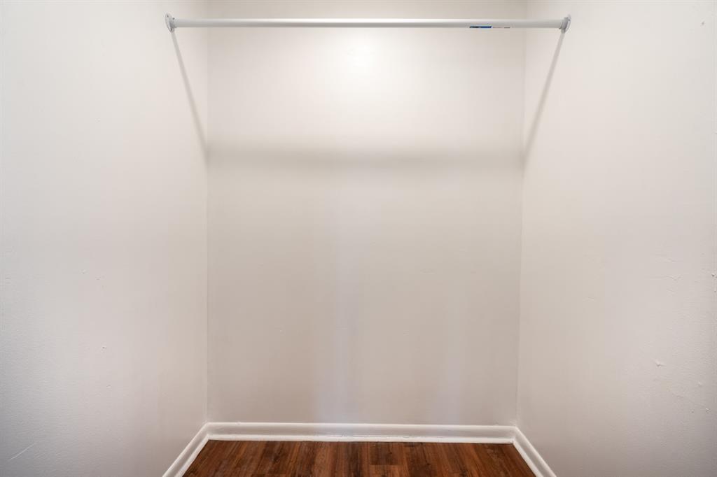 927 Northeast 199th Street, Unit 202 Miami, FL 33179 - Photo 32 of 39 a view of small space with racks on the wall