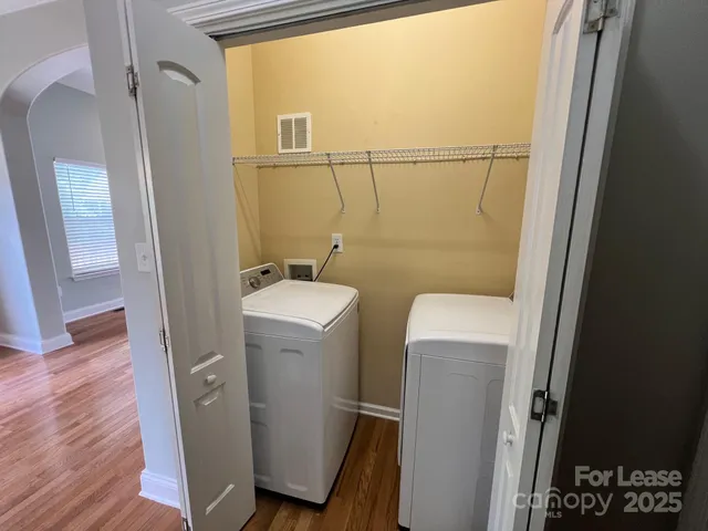 a bathroom with a sink and mirror with toilet
