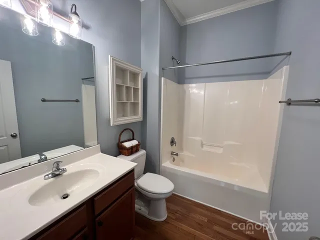 a bathroom with a sink toilet tub and shower