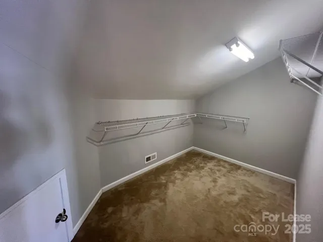 a view of a room with racks on the wall