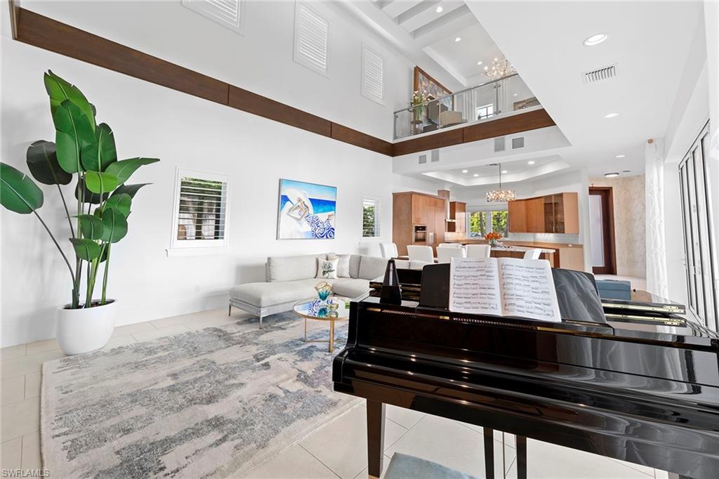 9149 Mercato Way Naples, FL 34108 - Photo 11 of 39 a living room with furniture and a potted plant