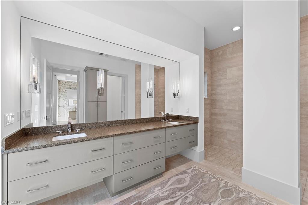 9149 Mercato Way Naples, FL 34108 - Photo 16 of 39 a bathroom with a granite countertop sink mirror and double