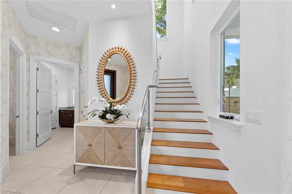 9149 Mercato Way Naples, FL 34108 - Photo 20 of 39 a view of entryway and hall with wooden floor