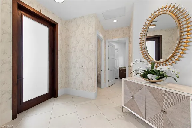 a room with mirror and entrance